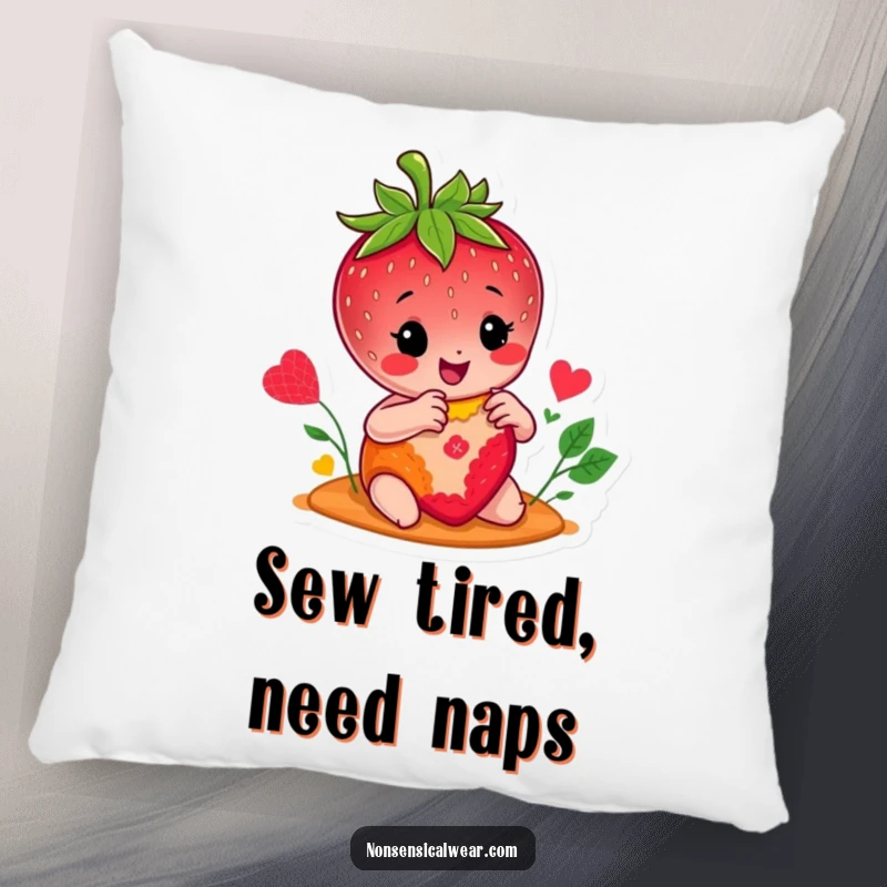 Funny pillow featuring a smiling strawberry character happily stitching a colorful patch, providing humorous and cozy decor for any room.