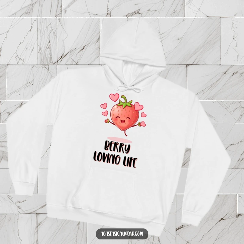 Funny cheerful strawberry character joyfully juggling hearts on a warm hoodie, radiating sweet and funny love.