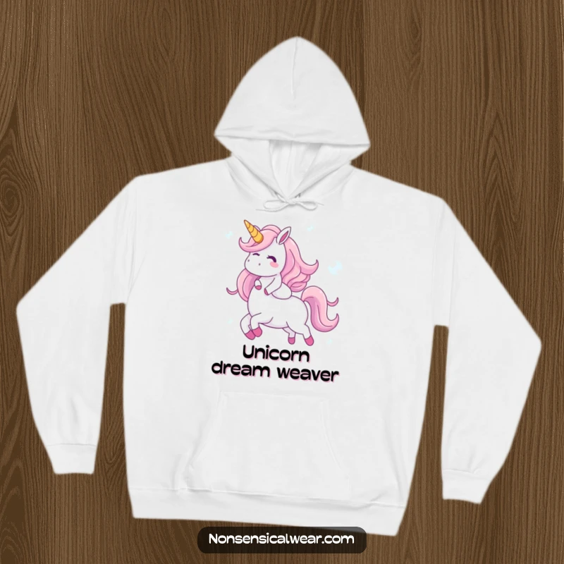 Funny hoodie depicting a giggling character joyfully riding a unicorn made of iridescent bubbles, perfect for staying cozy and embracing magical dreams.