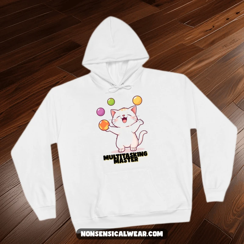 Funny Kawaii Cat Hoodie: A cute kawaii cat is depicted in the act of skillfully juggling three colorful balls.