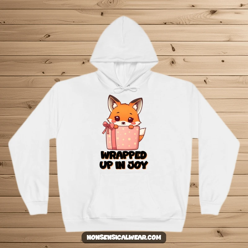 Funny kawaii fox hiding behind a huge, bright gift box, offering a humorous and adorable look on this cozy hoodie.