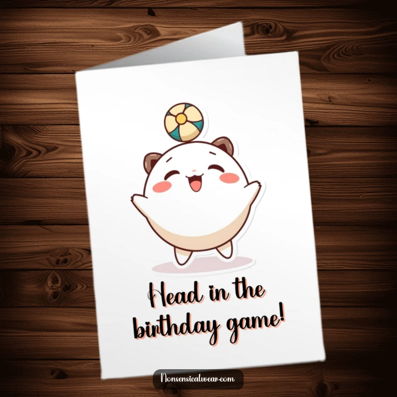 Funny Free Printable Birthday Card: Round character smiles while gleefully bouncing a ball with its head.