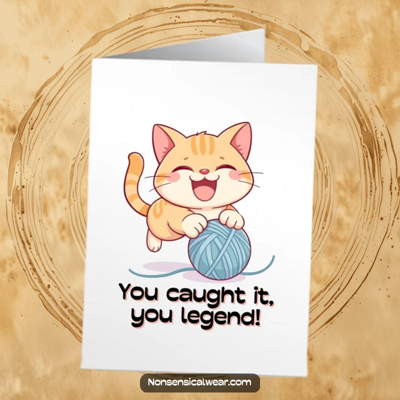 Funny Free Printable Cat Congratulations Card featuring a mischievous cat pouncing on a yarn ball, celebrating victory with glee.