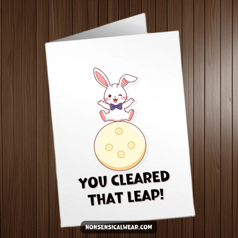 Funny Free Printable Congratulations Card showing a playful rabbit in a bow tie, leaping triumphantly over a giant button.