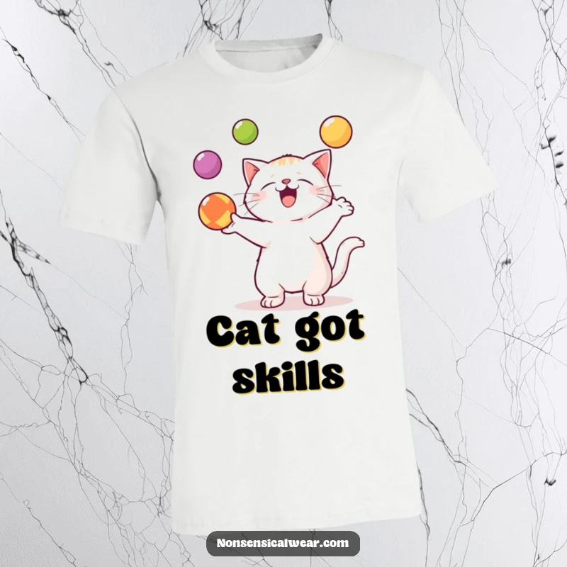 Funny Kawaii Cat T-Shirt: An adorable kawaii cat expertly juggles three vibrant balls, showcasing feline dexterity.