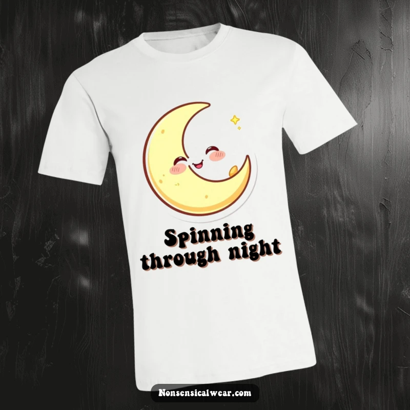Funny t-shirt graphic of a happy crescent moon character winking and spinning with joyful abandon, radiating cosmic delight.