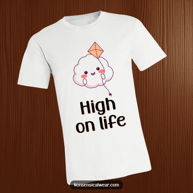 Funny t-shirt graphic of a smiling, round cloud character happily floating along, playfully holding a kite aloft in the breeze.