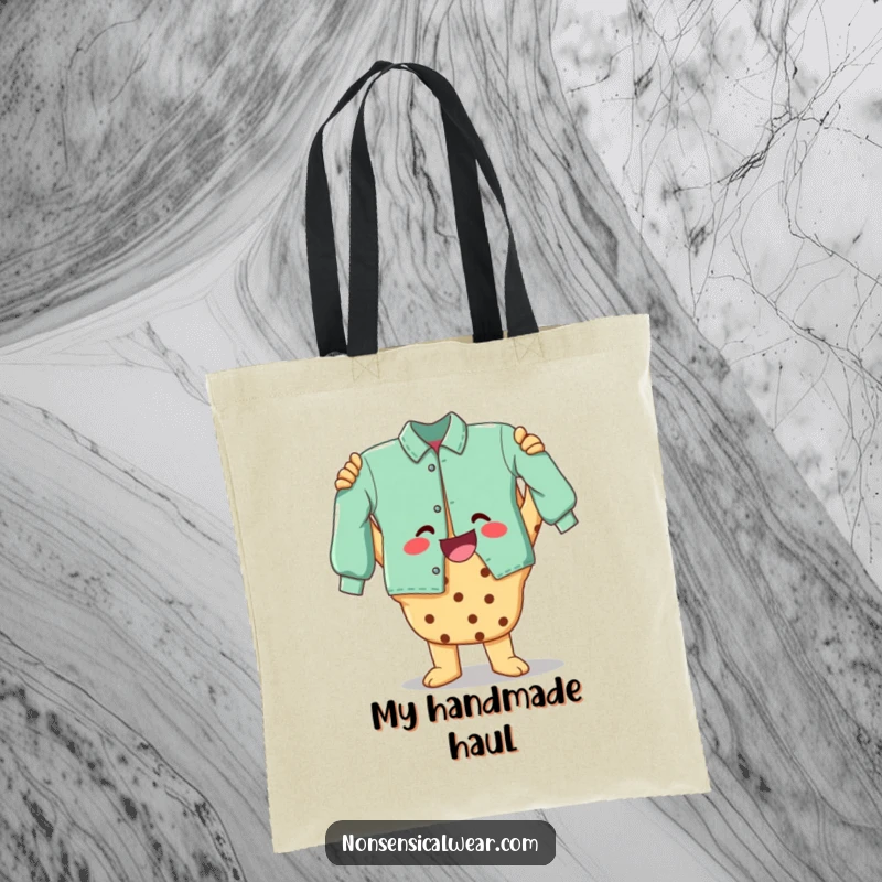 Funny tote bag depicting a beaming cookie character proudly holding a finished craft, ideal for carrying supplies.