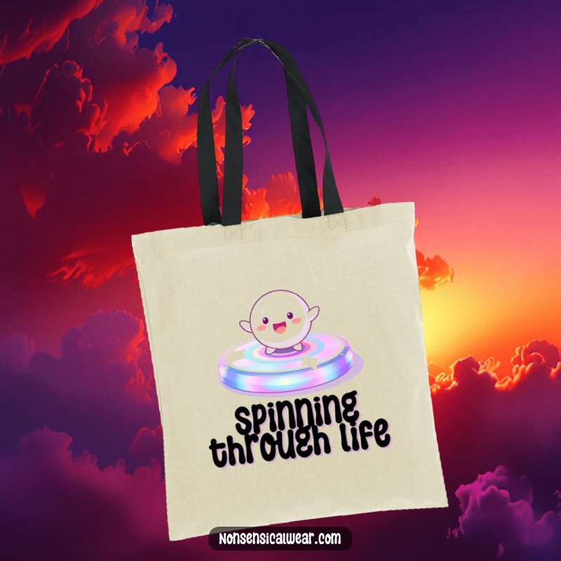 Funny Tote Bag: A playful, spherical character gleefully spinning on a vibrant, iridescent platform, great for carrying essentials.