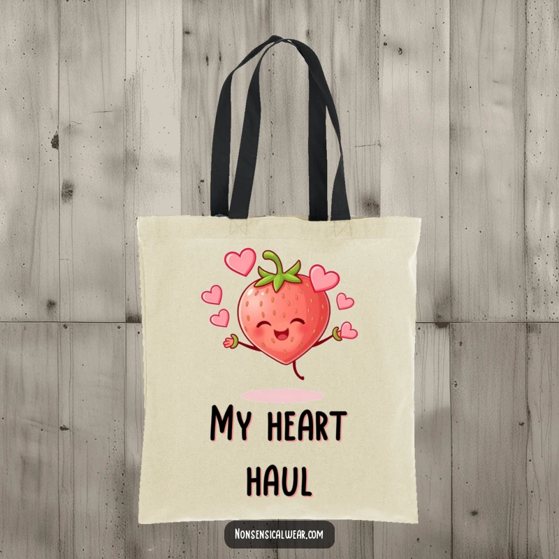 Funny cheerful strawberry character joyfully juggling hearts on a durable tote bag, a practical and loving accessory.