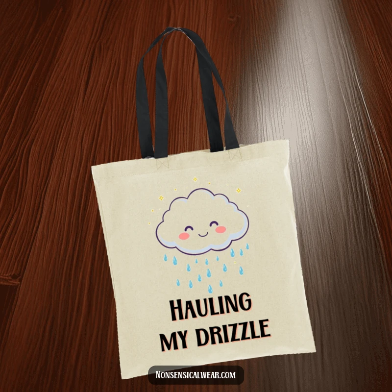 Funny tote bag with a cute, grinning cloud character showering gentle, sparkling raindrops, perfect for carrying sunny day essentials.
