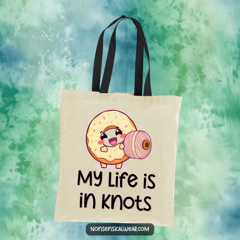 Funny tote bag showcasing a giggling donut character comically winding a large spool of thread, a humorous and practical accessory.