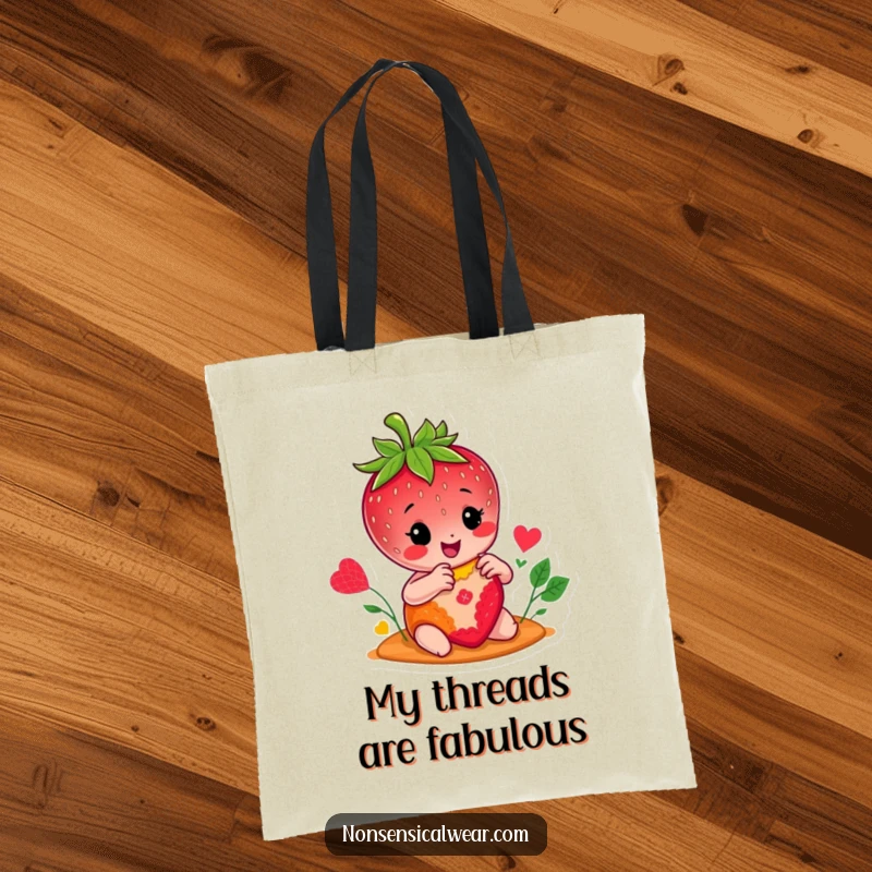 Funny tote bag with a cheerful strawberry character busy stitching a colorful patch, a practical and humorous accessory for crafters.