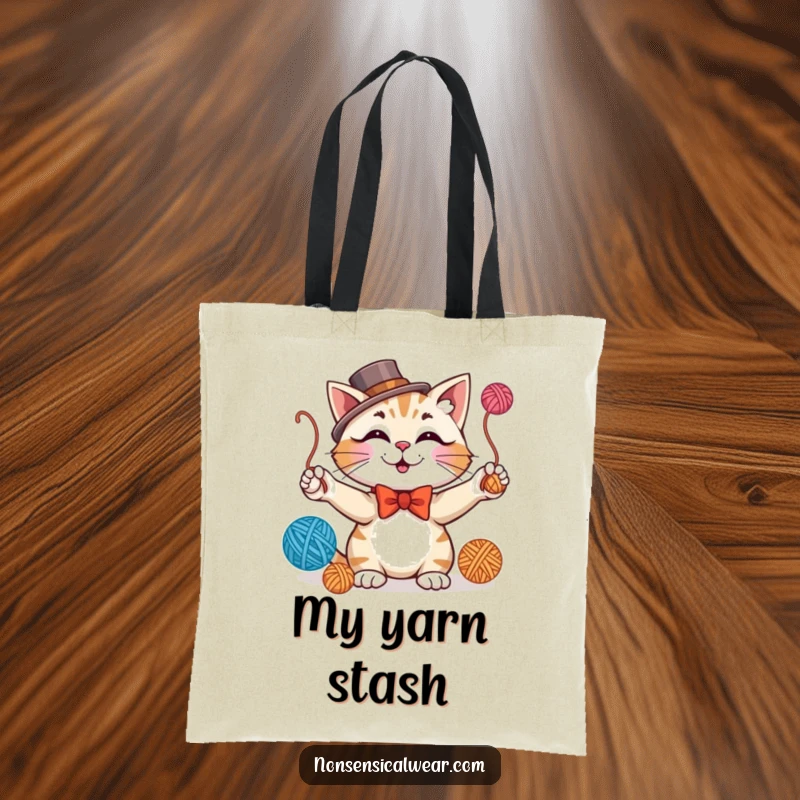 Funny tote bag showcasing a smiling cat in formal attire, juggling yarn balls with playful dapper charm.